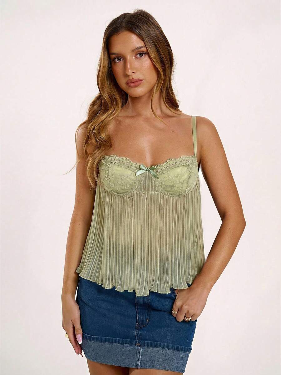 Black slim fit lace camisole corset top featuring lettuce trim flared hem, spaghetti straps, and unlined cup details.