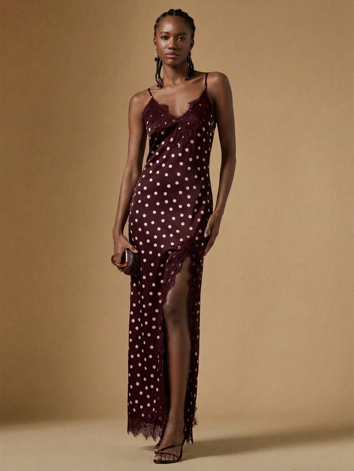 Women's black lace split satin long dress featuring spaghetti straps, asymmetrical slit hem, and matching arm sleeves.