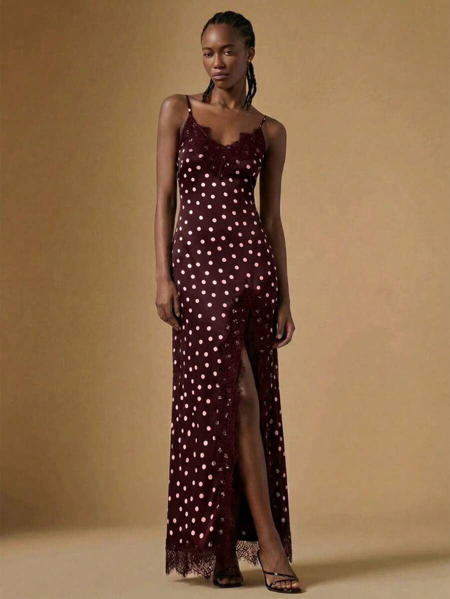 Women's black lace split satin long dress featuring spaghetti straps, asymmetrical slit hem, and matching arm sleeves.