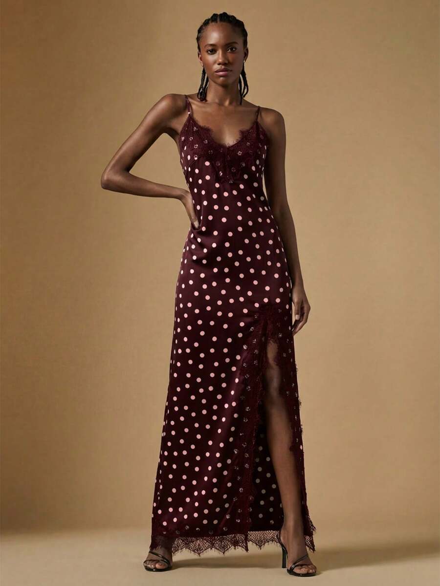 Women's black lace split satin long dress featuring spaghetti straps, asymmetrical slit hem, and matching arm sleeves.