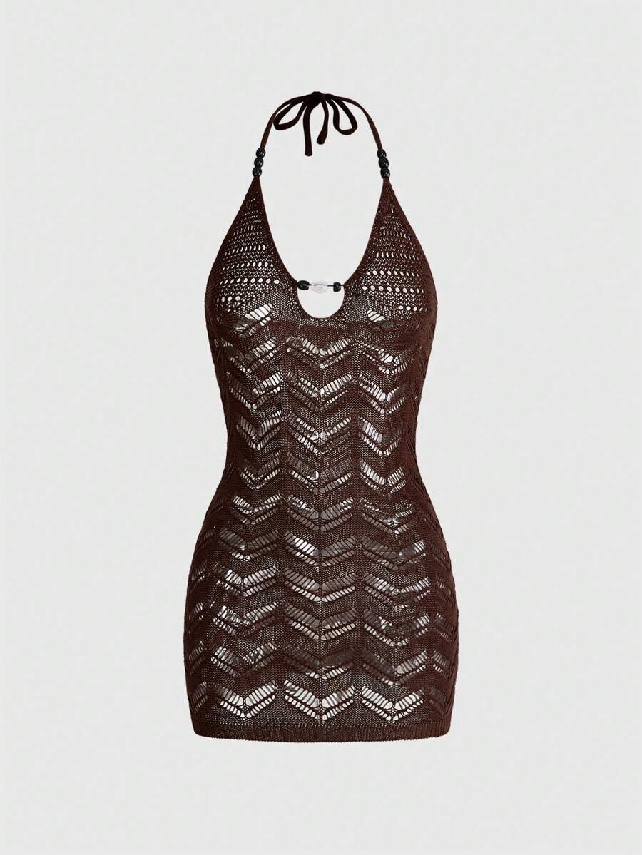 Front view of a brown halter knit mini dress featuring pointelle patterns and wood bead decor.