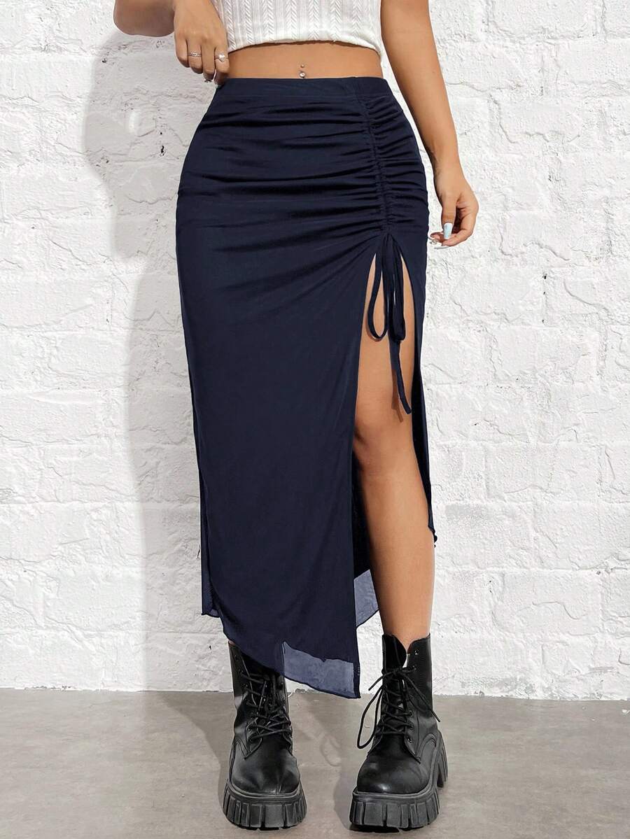Women's black high-waisted bodycon long skirt featuring a drawstring split thigh detail and mesh fabric.