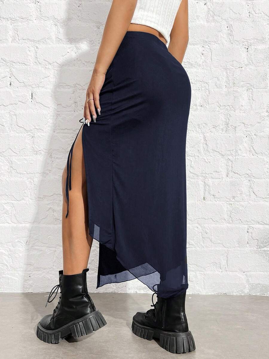 Women's black high-waisted bodycon long skirt featuring a drawstring split thigh detail and mesh fabric.