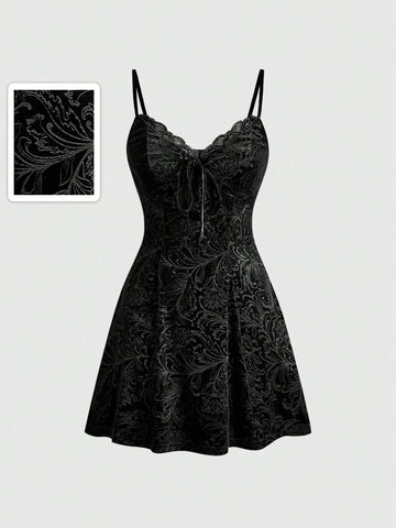 Women's black goth lace patchwork velvet mini slip dress with spaghetti straps, cup detail, high waist, and flared hem.