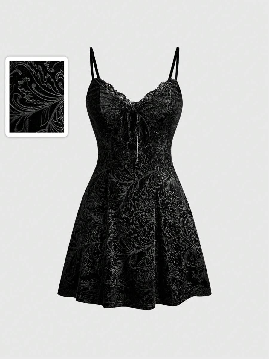 Women's black goth lace patchwork velvet mini slip dress with spaghetti straps, cup detail, high waist, and flared hem.