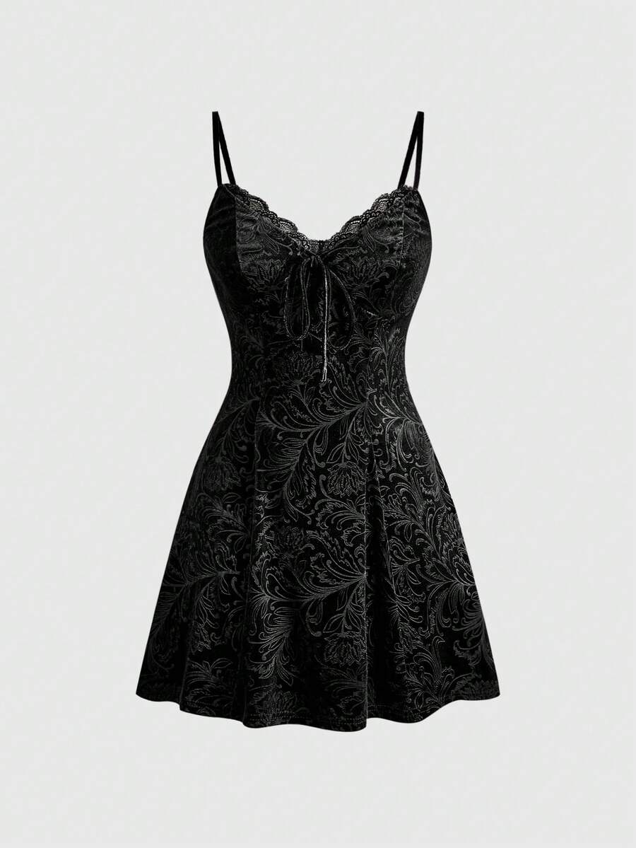 Women's black goth lace patchwork velvet mini slip dress with spaghetti straps, cup detail, high waist, and flared hem.