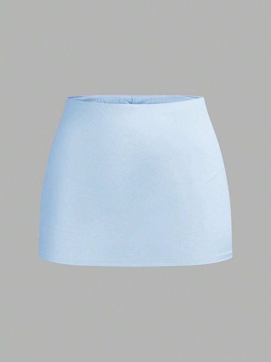 Women's black casual low rise bodycon mini skort with built-in shorts in knitted plain stretch fabric.