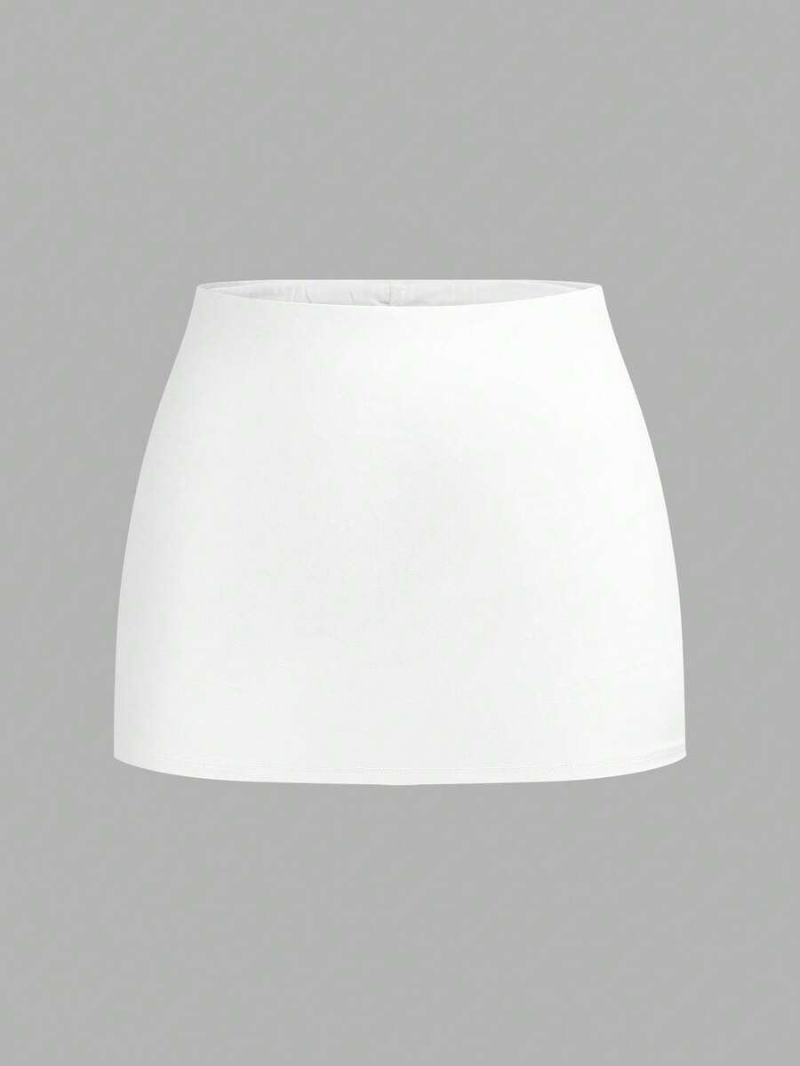 Women's black casual low rise bodycon mini skort with built-in shorts in knitted plain stretch fabric.