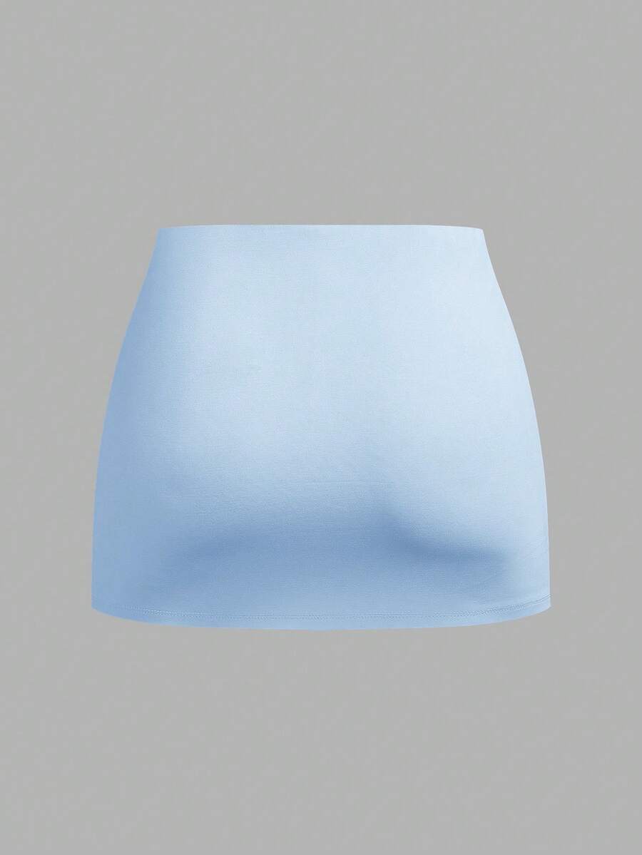 Women's black casual low rise bodycon mini skort with built-in shorts in knitted plain stretch fabric.