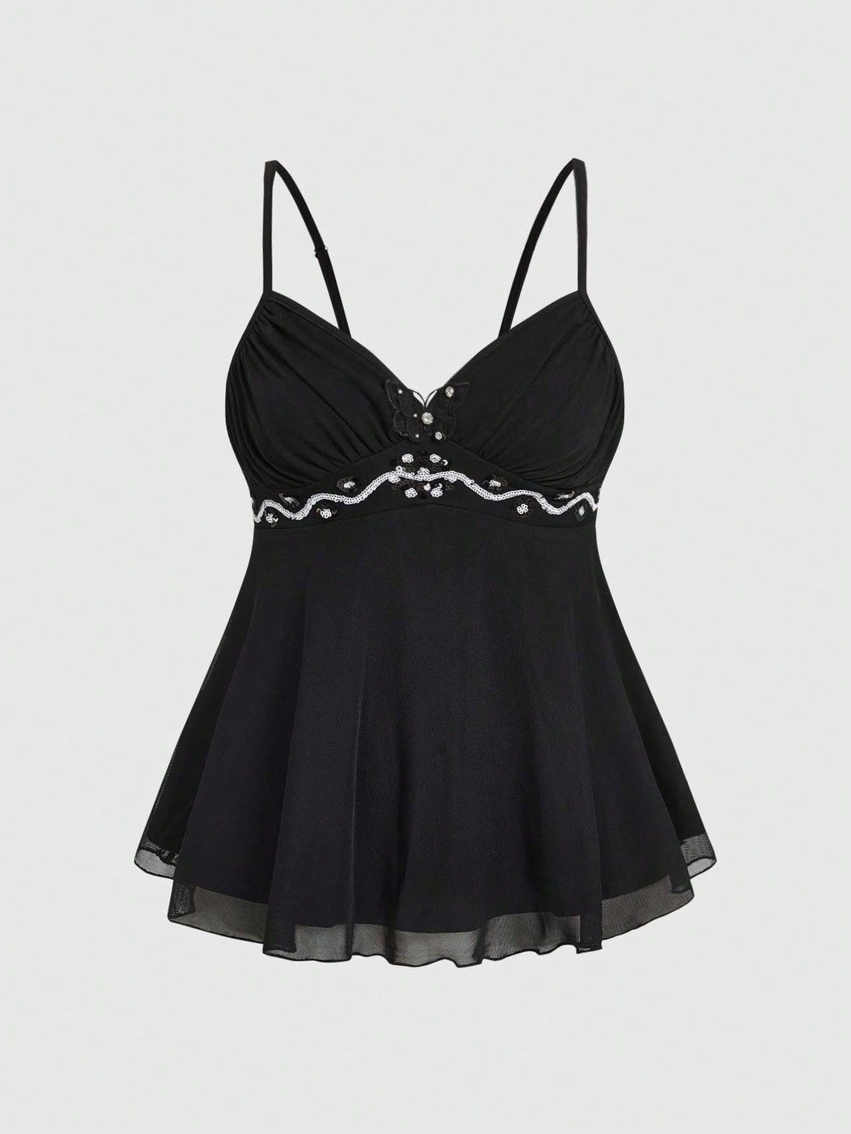Women's black slim-fit camisole top featuring ruched body design, decorative chain accent, ruffle hem, and cold-shoulder spaghetti straps.