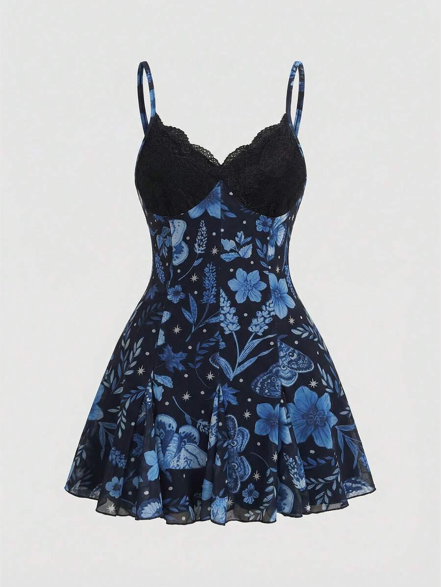 Women's black and white gothic cami mini dress featuring contrast lace trim, pleated details, high waist, and flared hem on high-stretch fabric.
