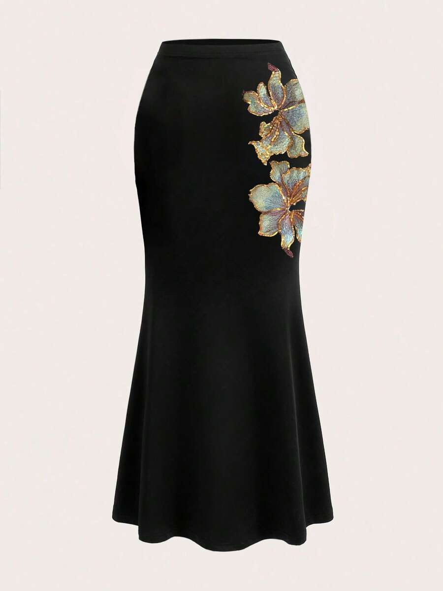 Women's black floral embroidered mermaid maxi skirt featuring high stretch fabric, skinny fit, and floor-length evening design.