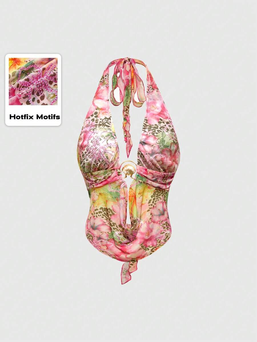 Women's pink backless halter top with rhinestone decor, knot detail, and asymmetrical hem.