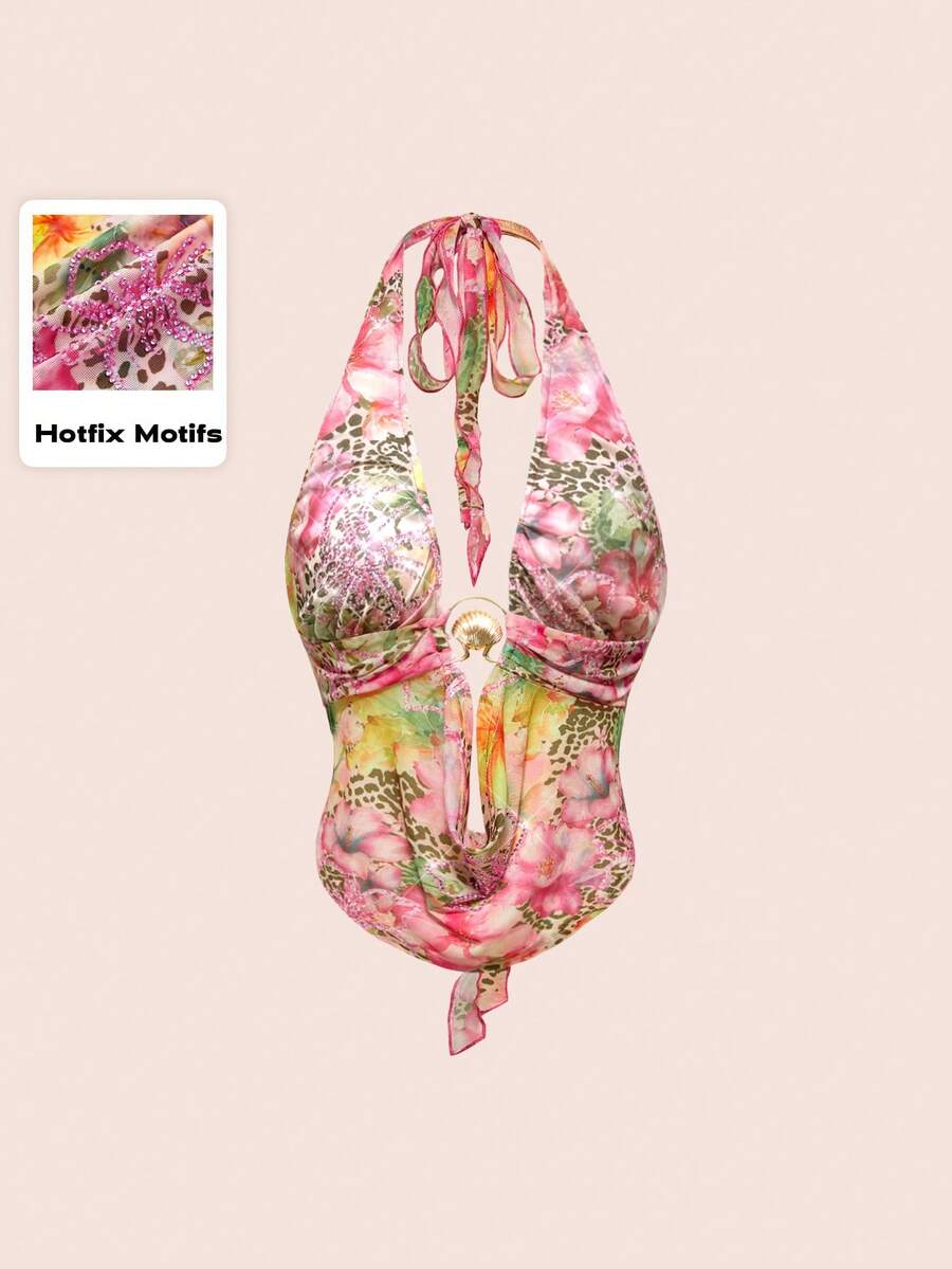 Women's pink backless halter top with rhinestone decor, knot detail, and asymmetrical hem.
