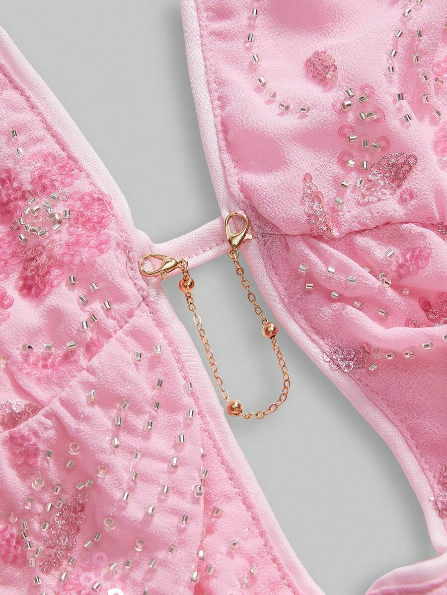 Pink sequin halter tank top for women featuring embroidered draped backless design and asymmetrical hem.