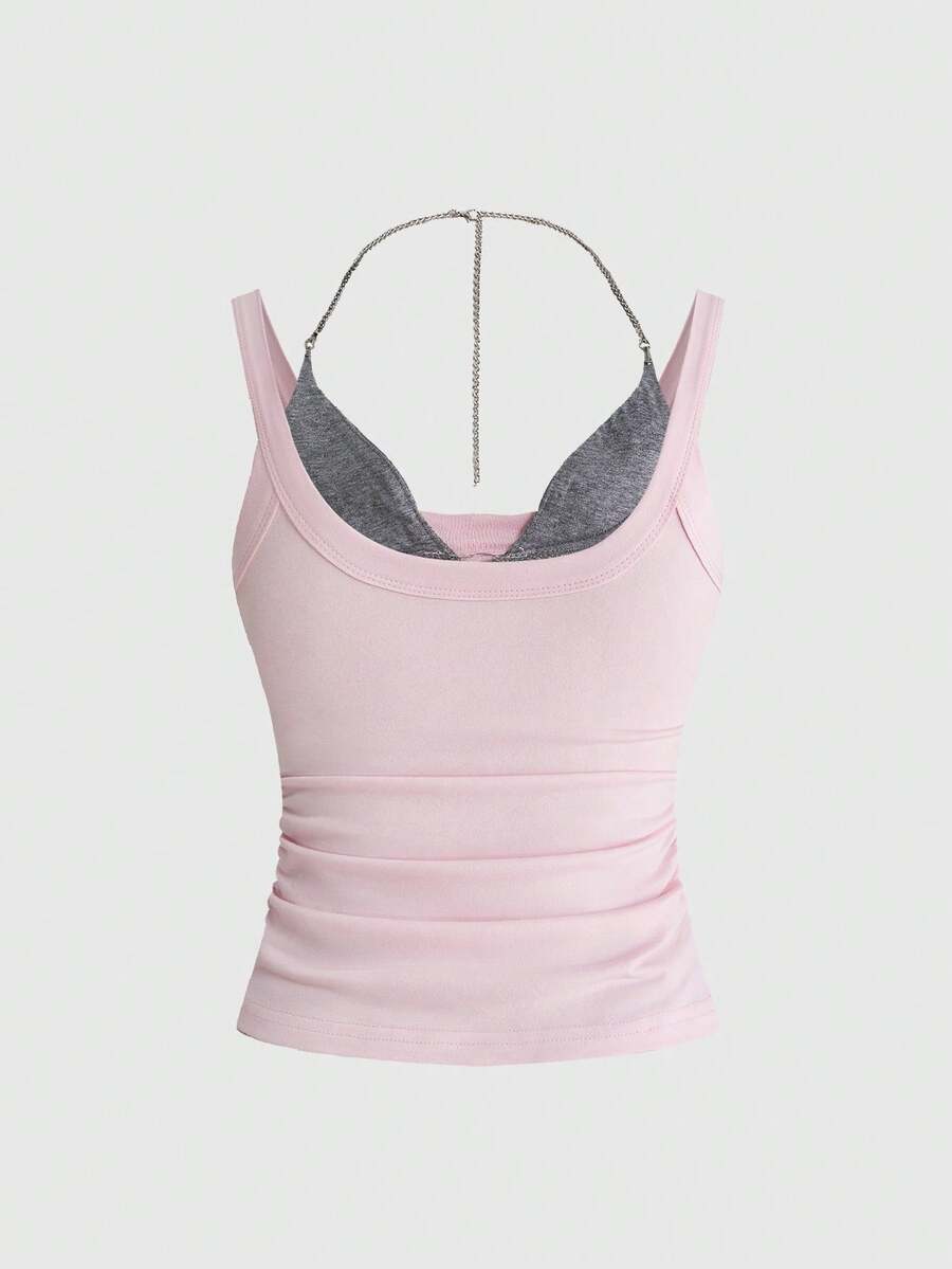 Backless grommet cami tank top featuring slim fit silhouette and strap details on knitted fabric