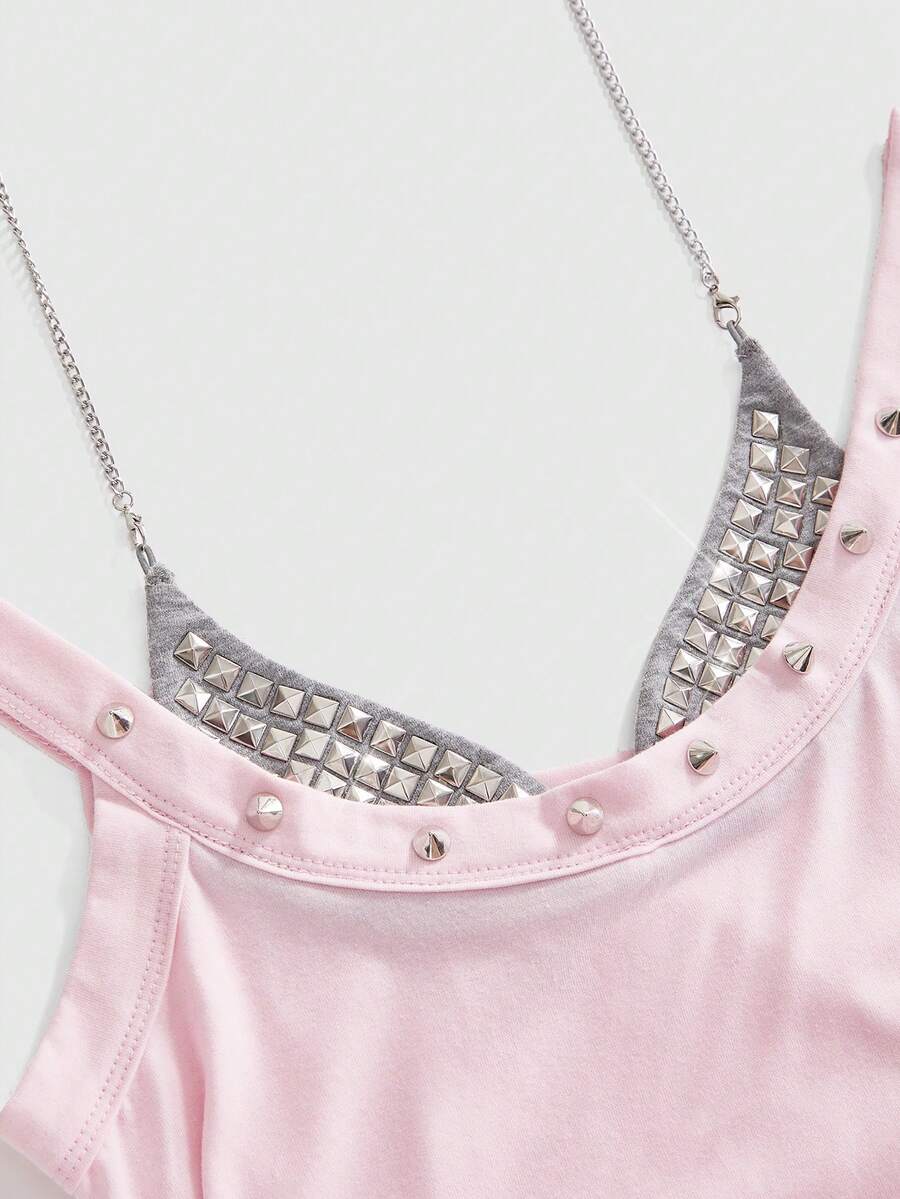 Backless grommet cami tank top featuring slim fit silhouette and strap details on knitted fabric