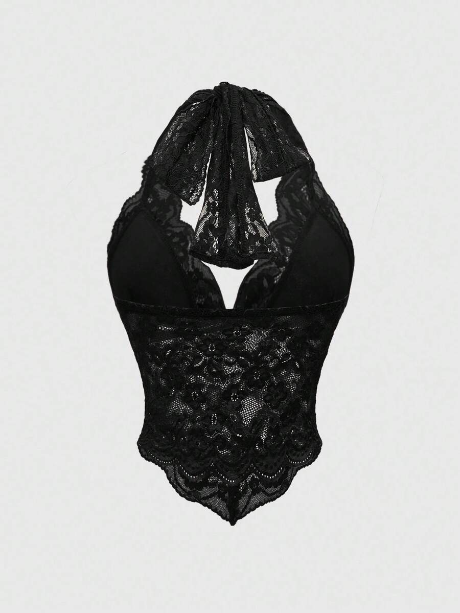 Women's black lace halter neck camisole featuring a backless crop silhouette, contrast lace trim, and scallop hem.