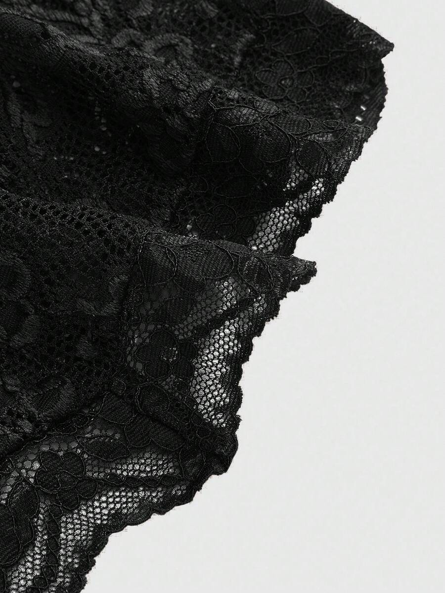 Women's black lace halter neck camisole featuring a backless crop silhouette, contrast lace trim, and scallop hem.