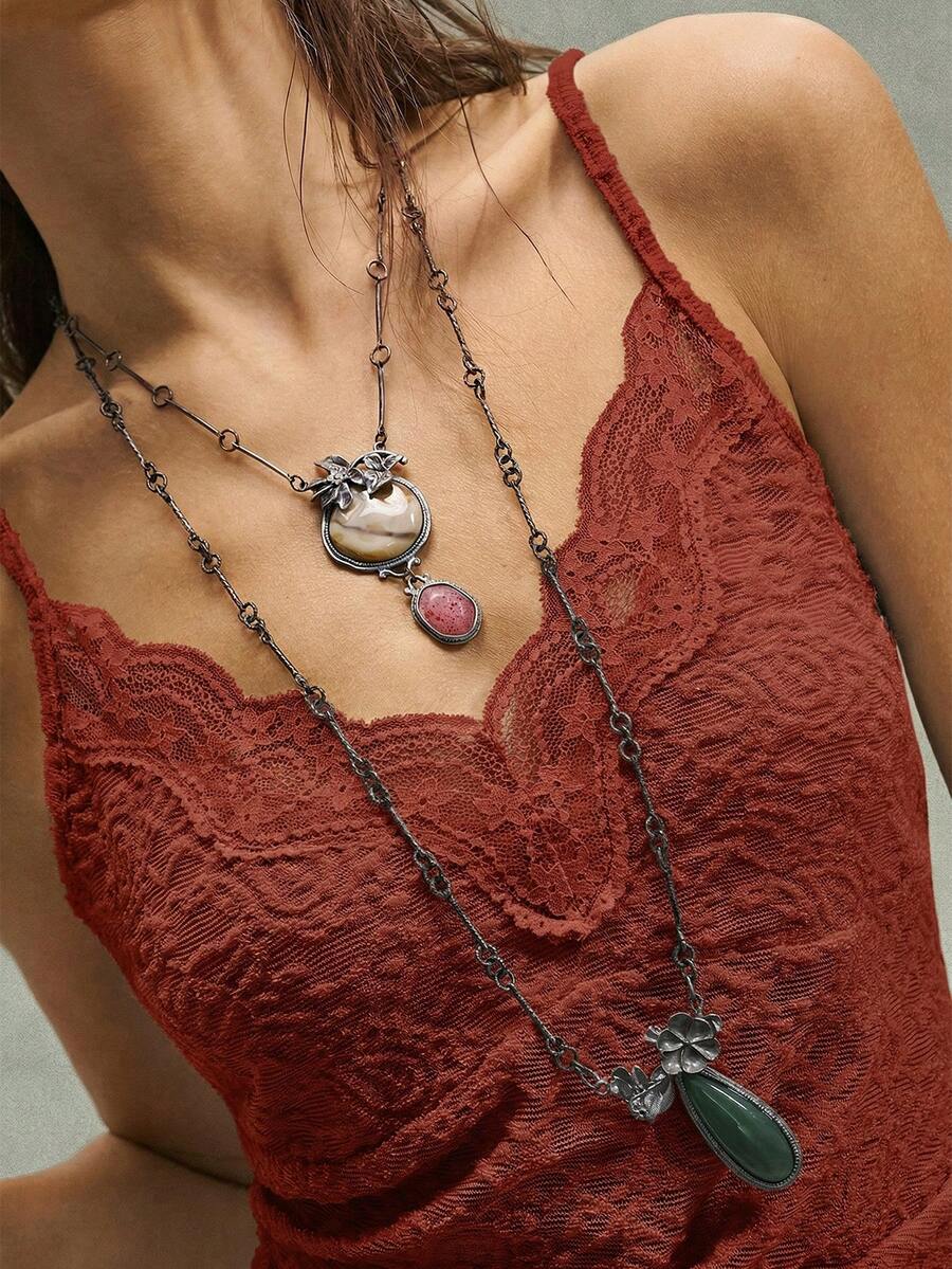 Black boho paisley knit camisole top featuring contrast lace details, spaghetti straps, and a slim crop fit for women