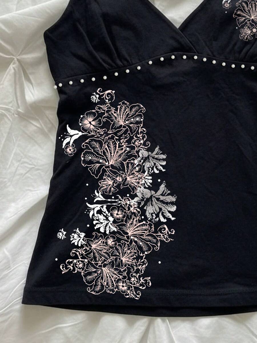 Women's slim fit spaghetti strap cami top featuring a tropical hibiscus floral graphic print.