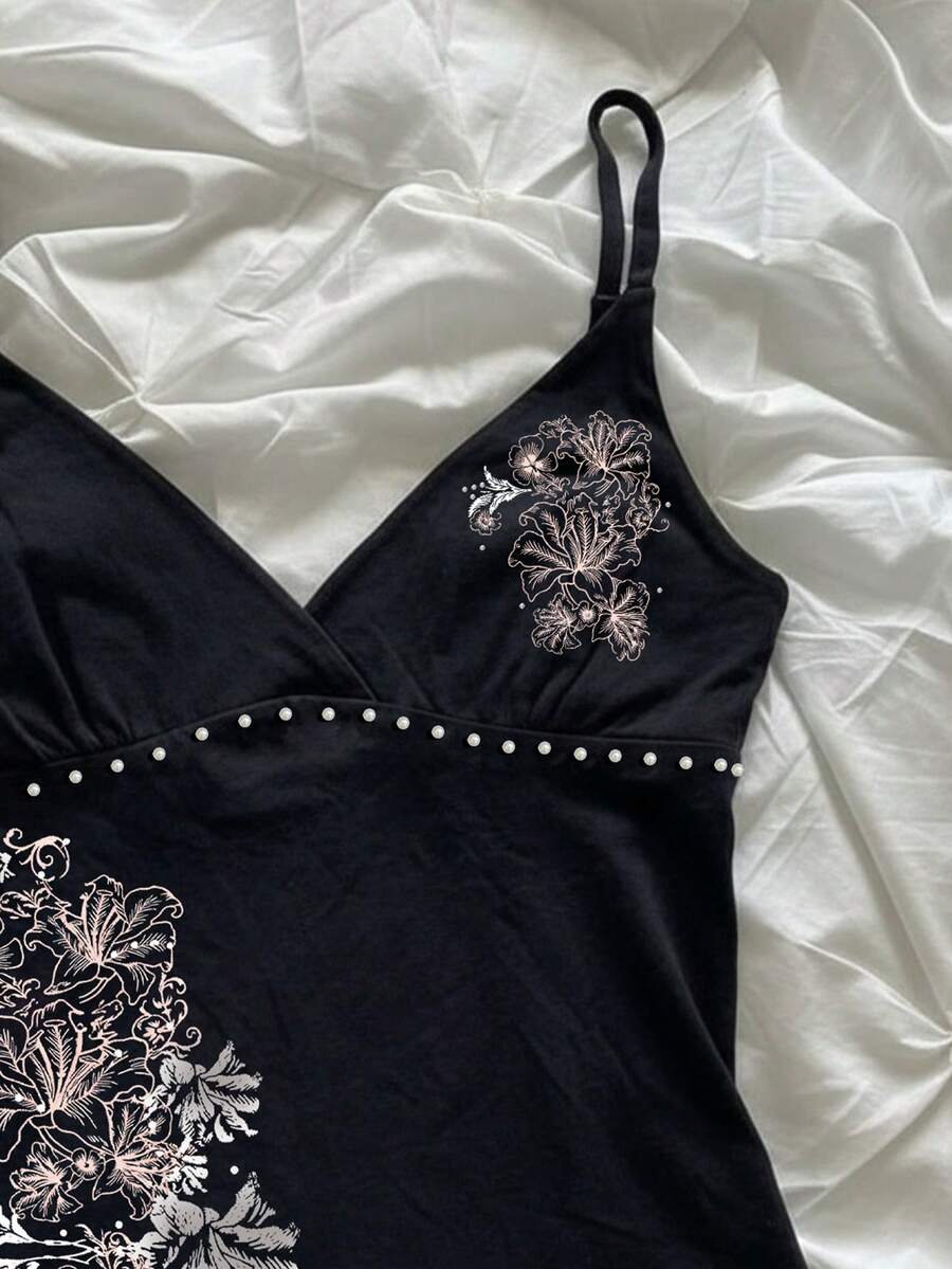 Women's slim fit spaghetti strap cami top featuring a tropical hibiscus floral graphic print.
