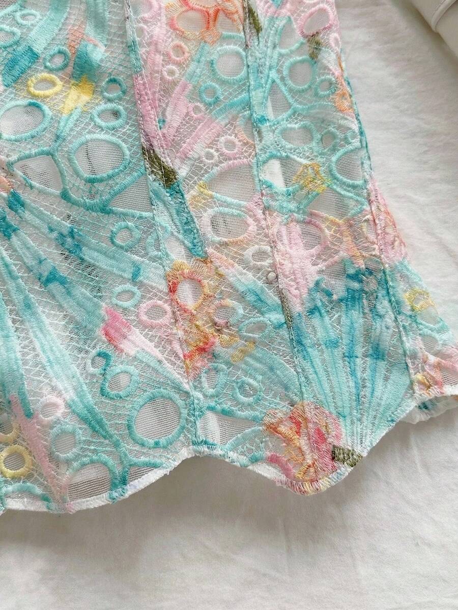 Strapless floral corset top with lace-up detail, asymmetrical hem, and slim fit for women in a boho vacation style.