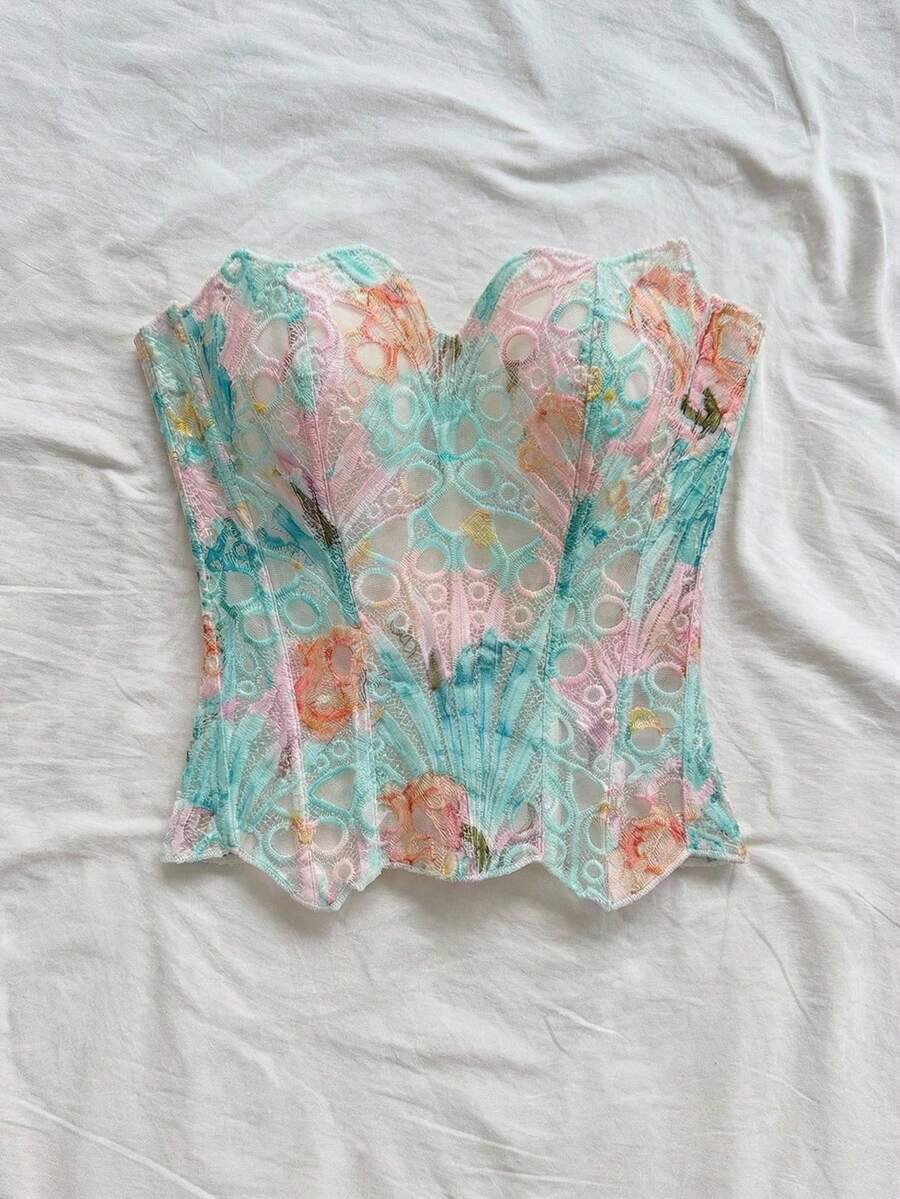 Strapless floral corset top with lace-up detail, asymmetrical hem, and slim fit for women in a boho vacation style.