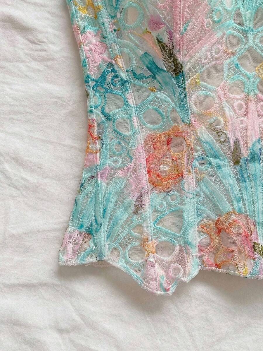 Strapless floral lace corset top with lace-up detail, asymmetrical hem, and slim fit for women.