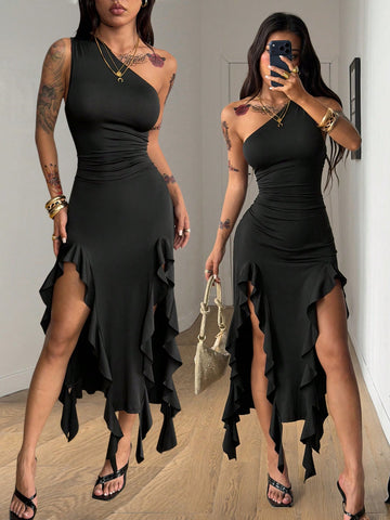 Black sleeveless asymmetrical bodycon long dress with ruffle detailing and a split thigh on a model.