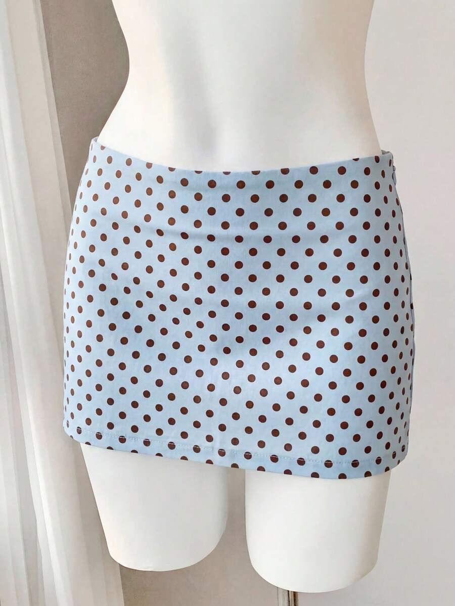 Women's white 100% cotton low waist mini skirt featuring a tropical print and zipper detail.