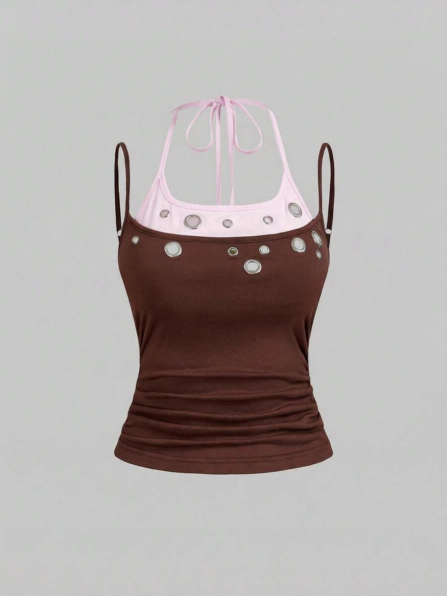 Black halter crop tank top for women featuring lace up front details, ruched accents, and appliques in a slim fit knitted fabric.