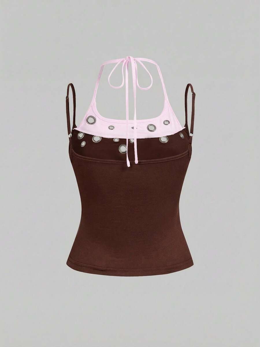 Black halter crop tank top for women featuring lace up front details, ruched accents, and appliques in a slim fit knitted fabric.
