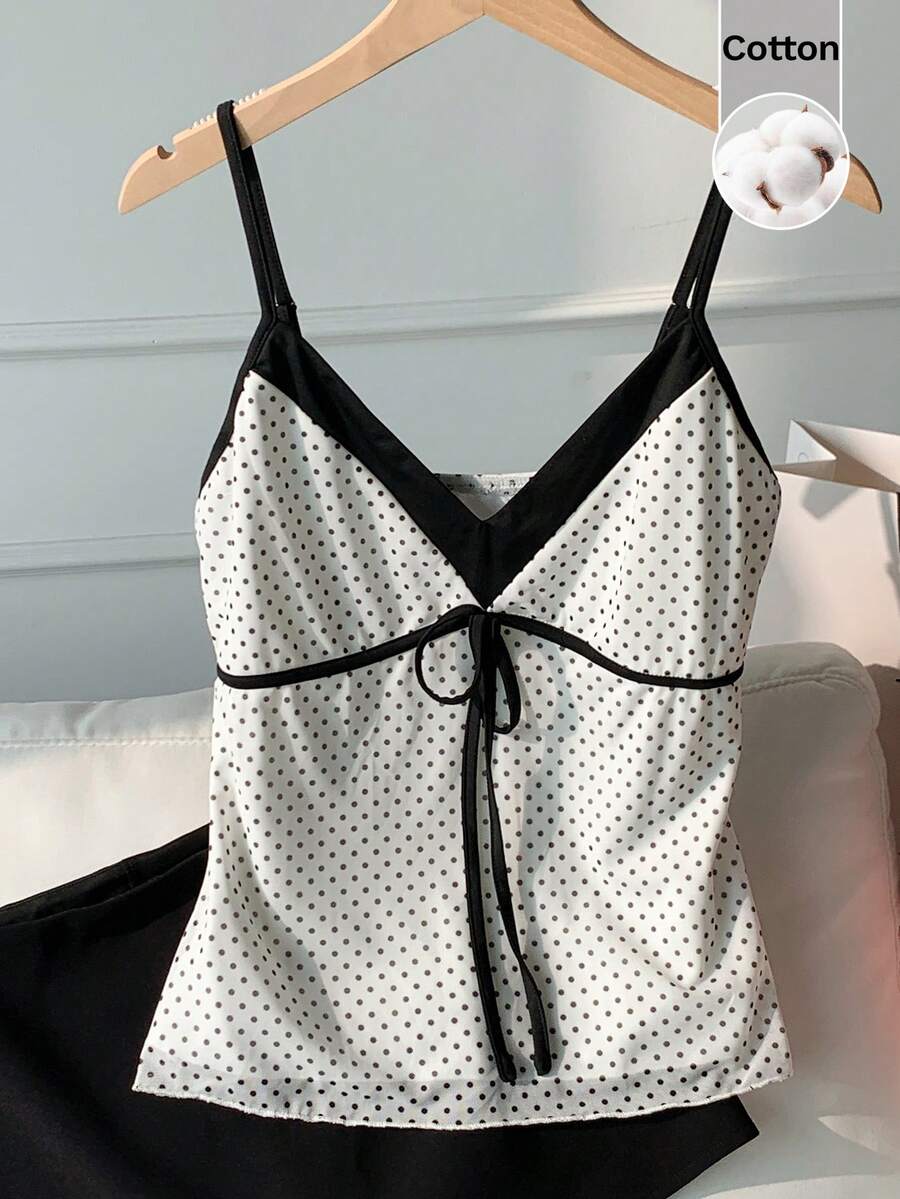 Black and white polka dot tie strap camisole top for women with thin spaghetti straps and slim fit.