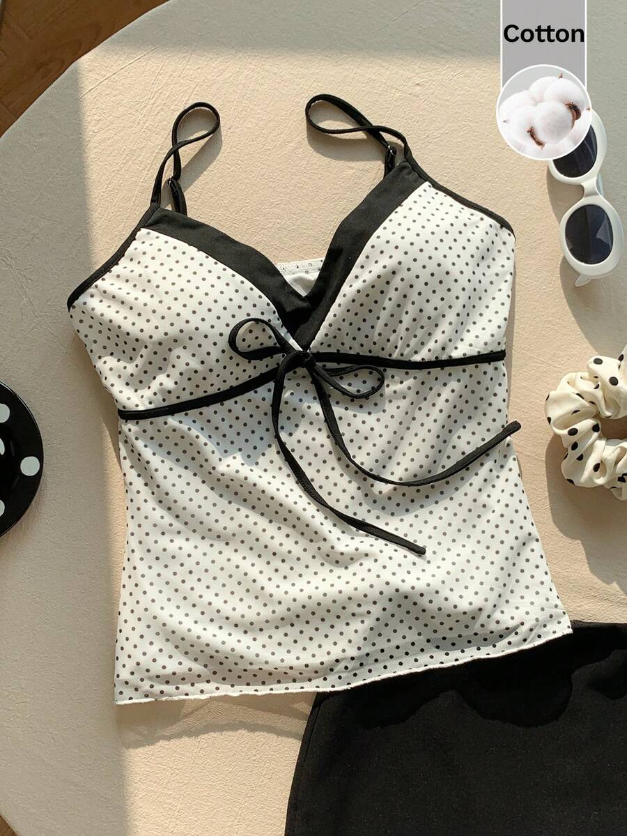 Black and white polka dot tie strap camisole top for women with thin spaghetti straps and slim fit.