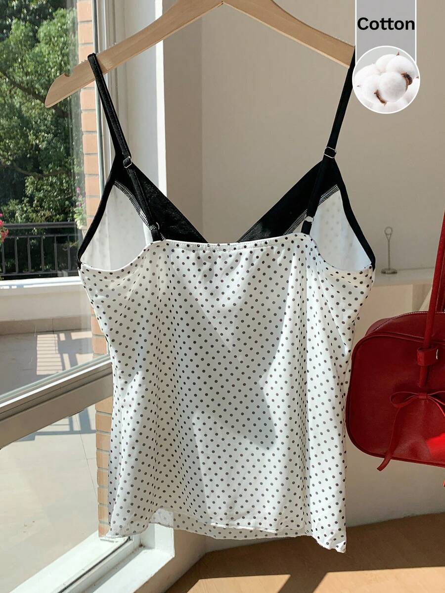 Black and white polka dot tie strap camisole top for women with thin spaghetti straps and slim fit.