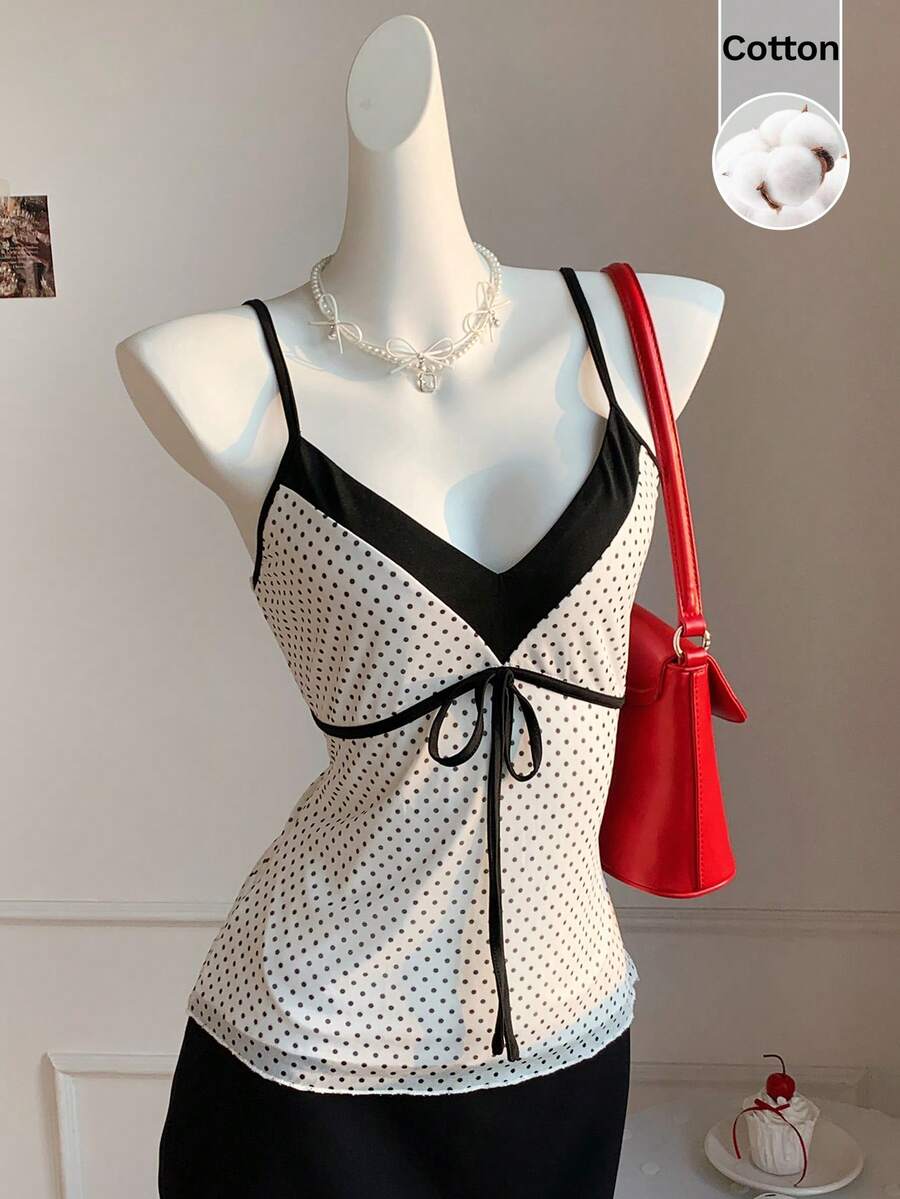 Black and white polka dot tie strap camisole top for women with thin spaghetti straps and slim fit.