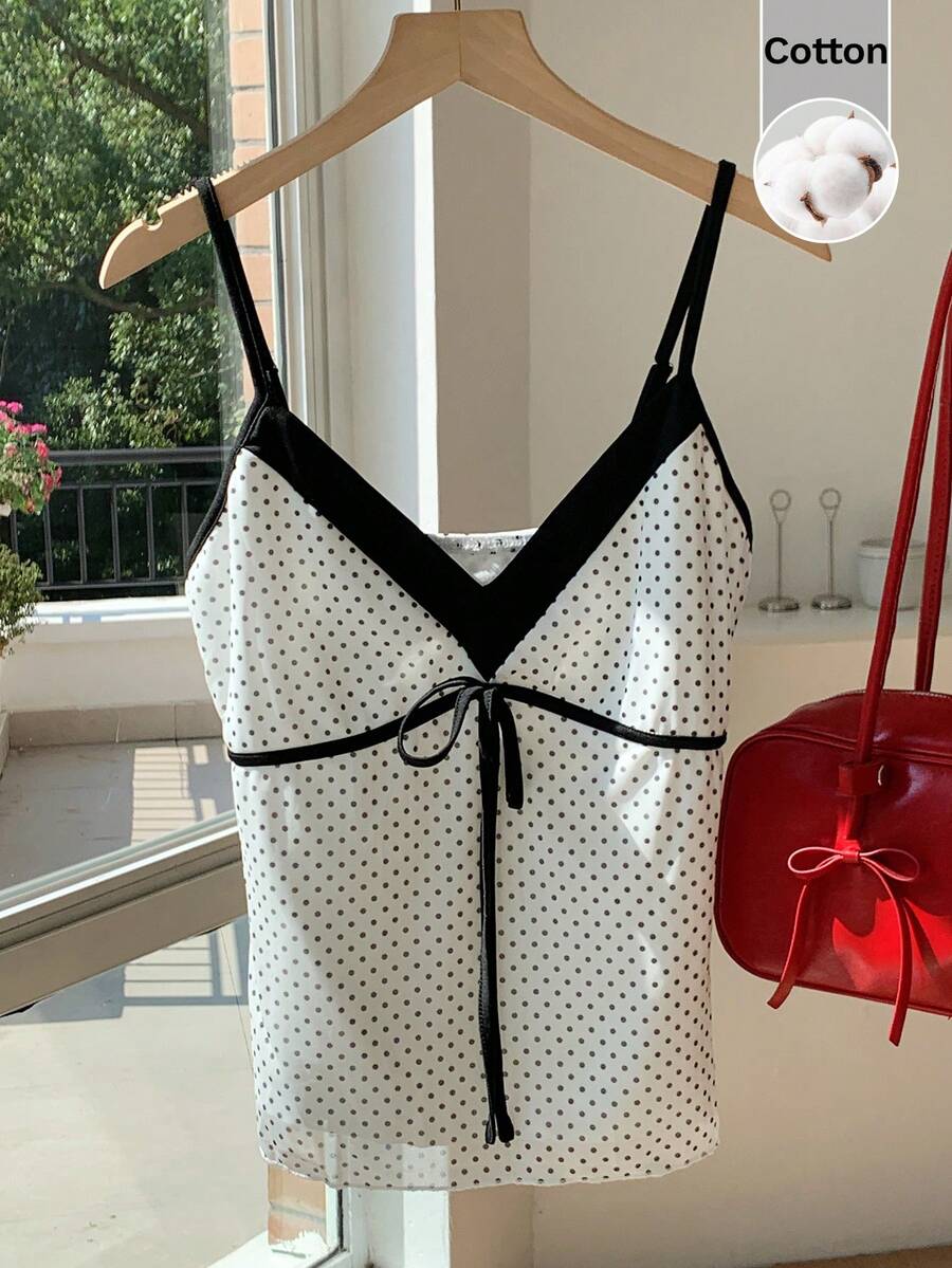 Black and white polka dot tie strap camisole top for women with thin spaghetti straps and slim fit.