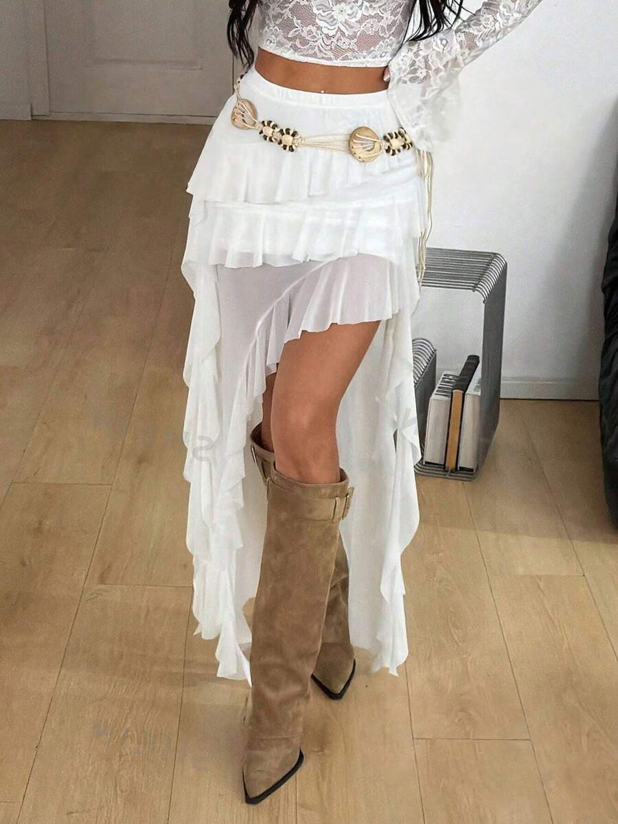 Women's low rise asymmetrical long skirt with tiered ruffle details in stretch knitted fabric.