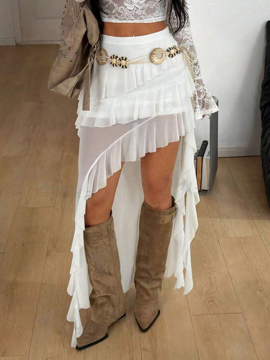 Women's low rise asymmetrical long skirt with tiered ruffle details in stretch knitted fabric.