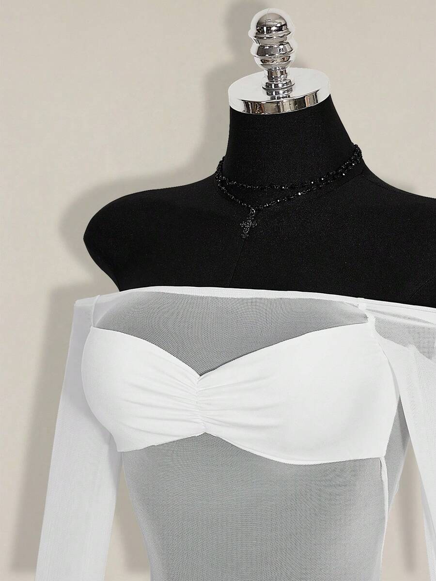 Women's black off-shoulder mini dress featuring sheer mesh patchwork details, ruched bodycon fit, and long flare sleeves.