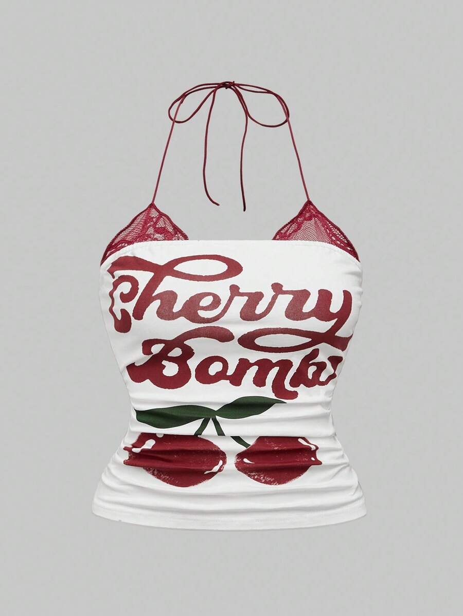 Multicolor graphic crop halter top with contrast lace trim and knot detail in a slim fit stretch knit fabric.