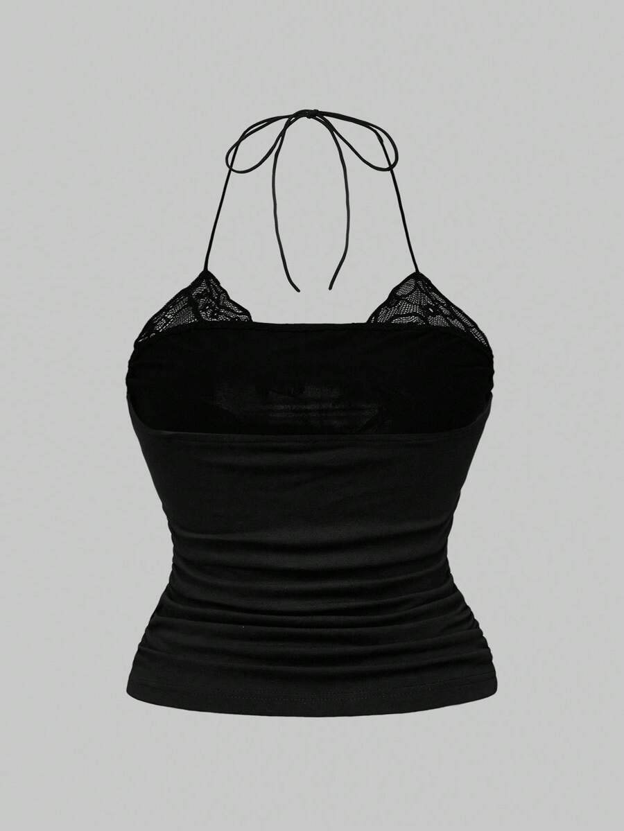 Multicolor graphic crop halter top with contrast lace trim and knot detail in a slim fit stretch knit fabric.