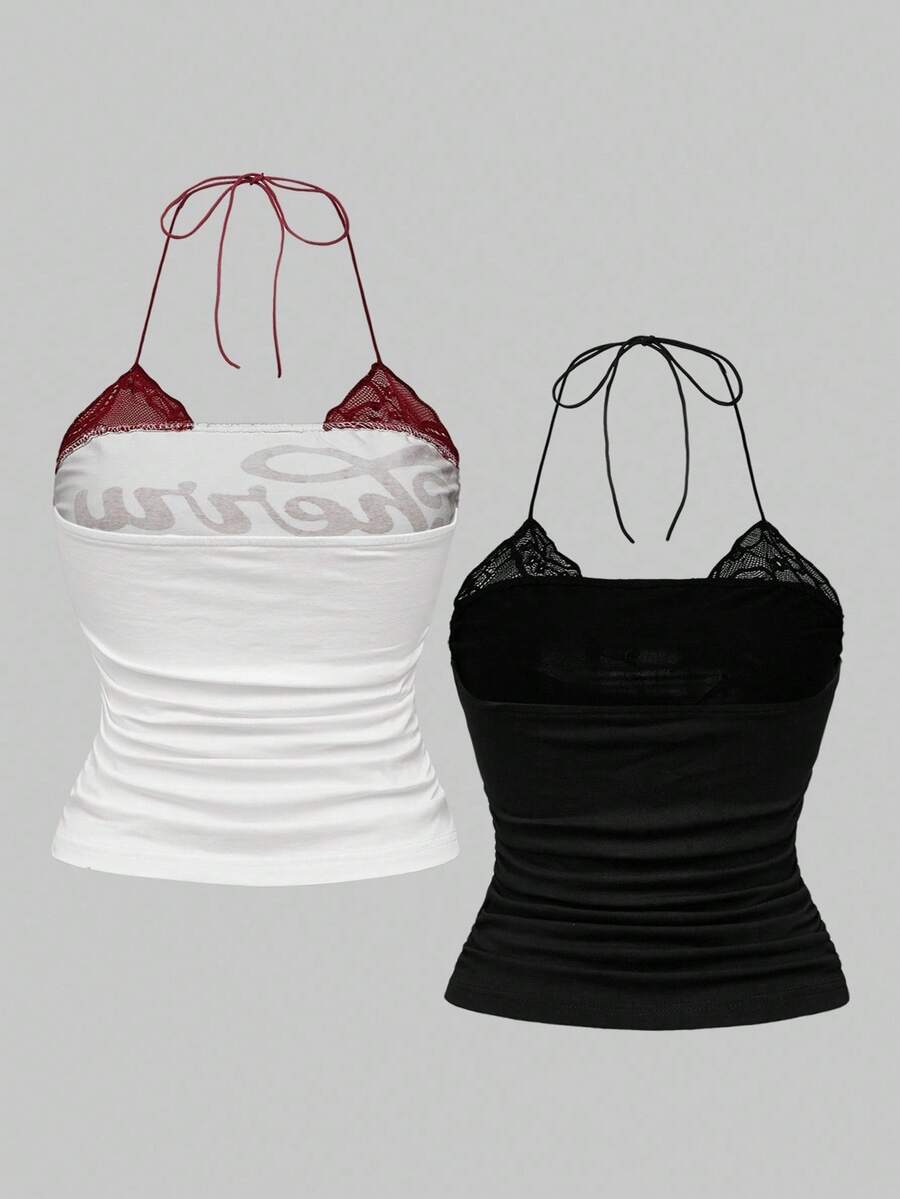 Multicolor graphic crop halter top with contrast lace trim and knot detail in a slim fit stretch knit fabric.