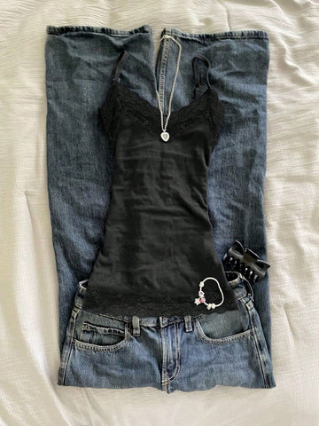 Women's solid color slim fit camisole top featuring delicate lace patchwork embroidery and tank straps.