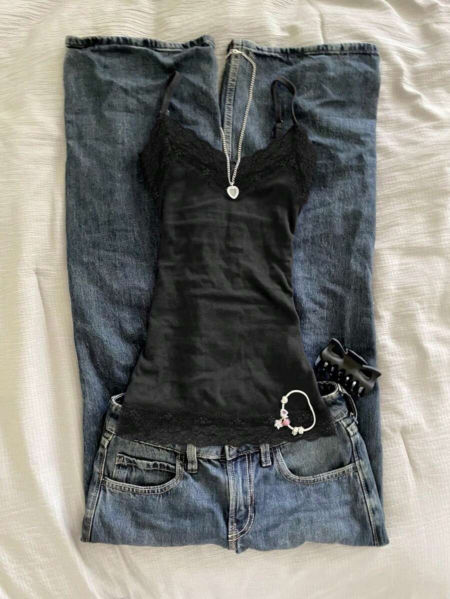 Women's solid color slim fit camisole top featuring delicate lace patchwork embroidery and tank straps.