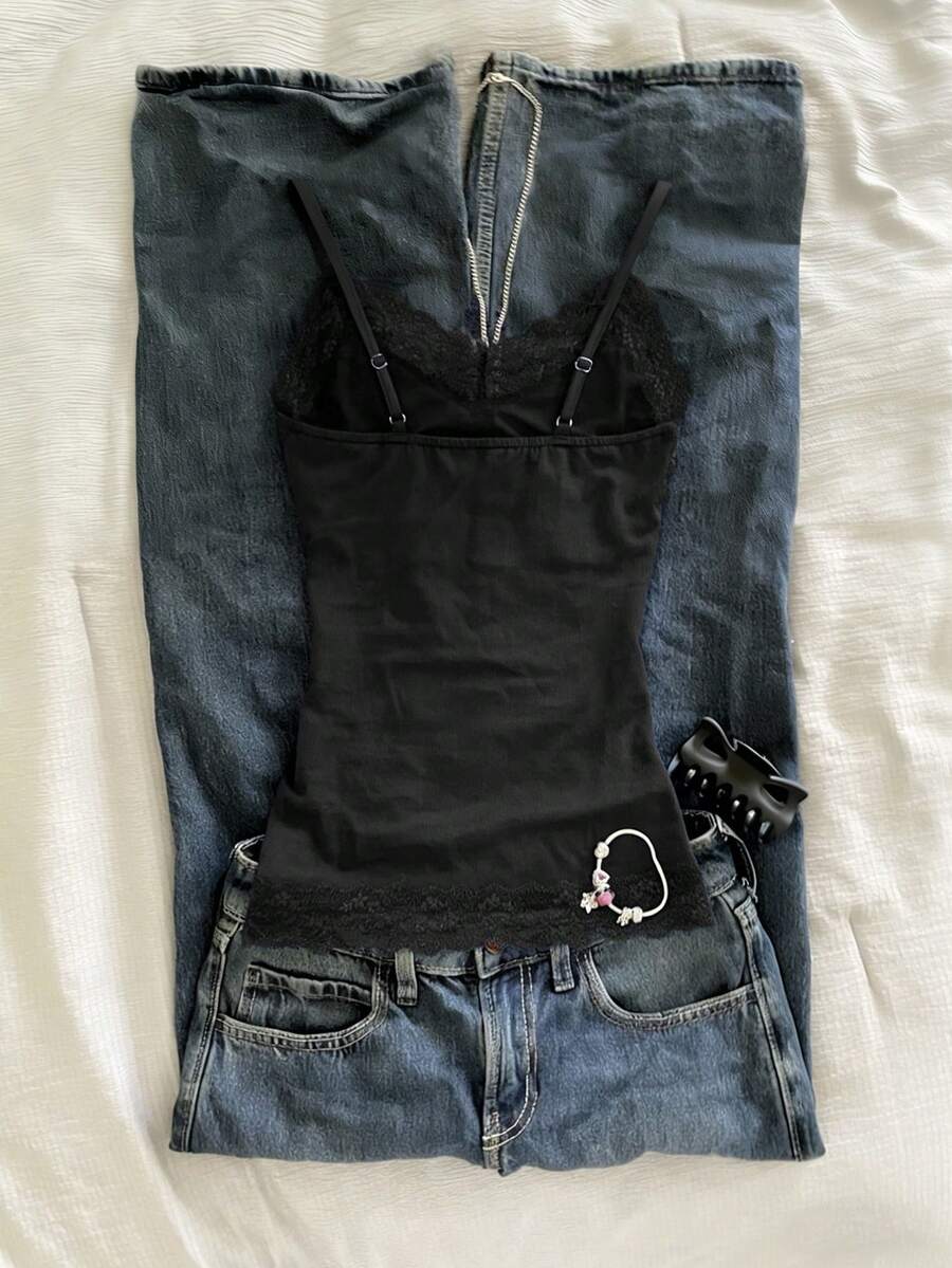 Women's solid color slim fit camisole top featuring delicate lace patchwork embroidery and tank straps.