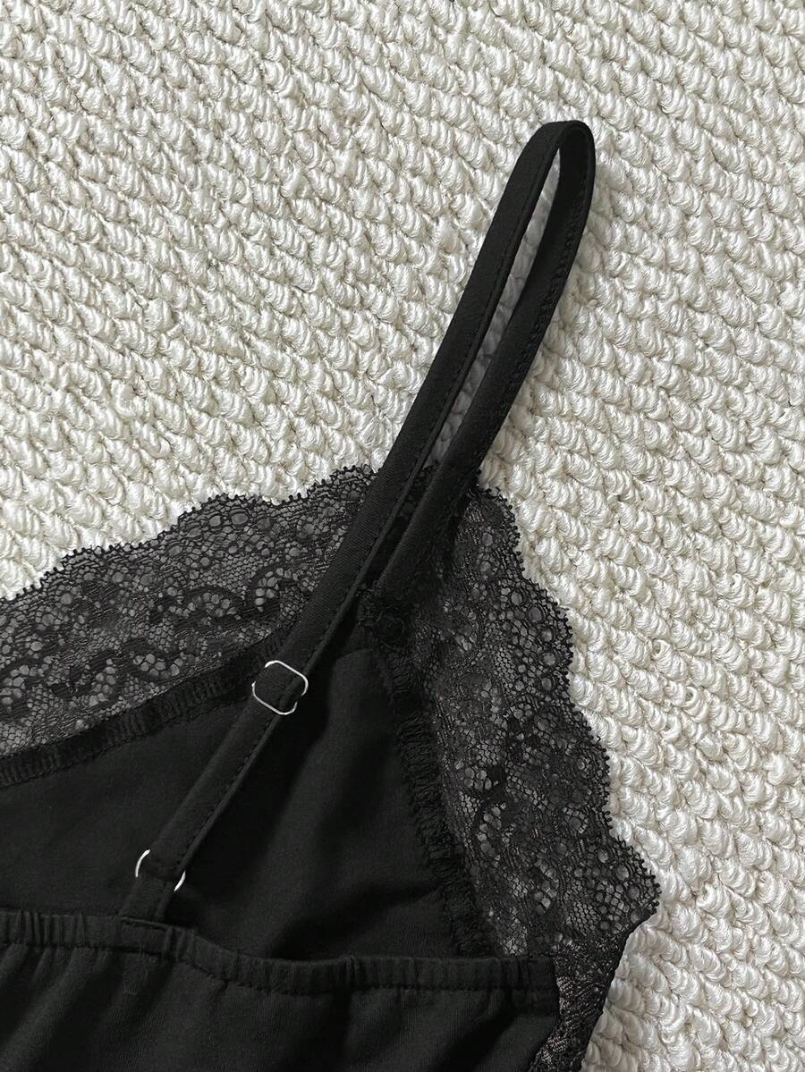 Women's solid color slim fit camisole top featuring delicate lace patchwork embroidery and tank straps.