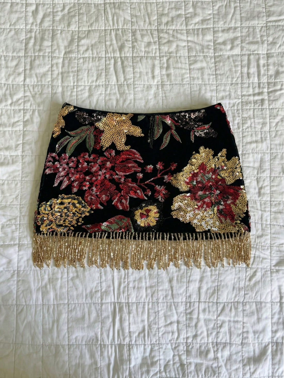 Elamini women's floral fringe bodycon mini skirt with a low waist and lined knit design.