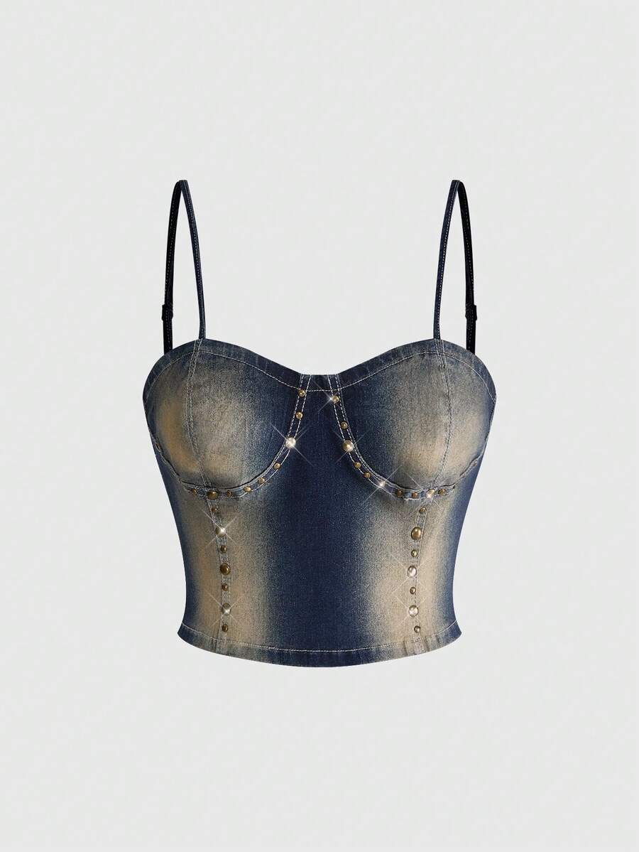 Women's medium wash denim camisole crop top featuring spaghetti straps, cup detailing, and rivet accents.